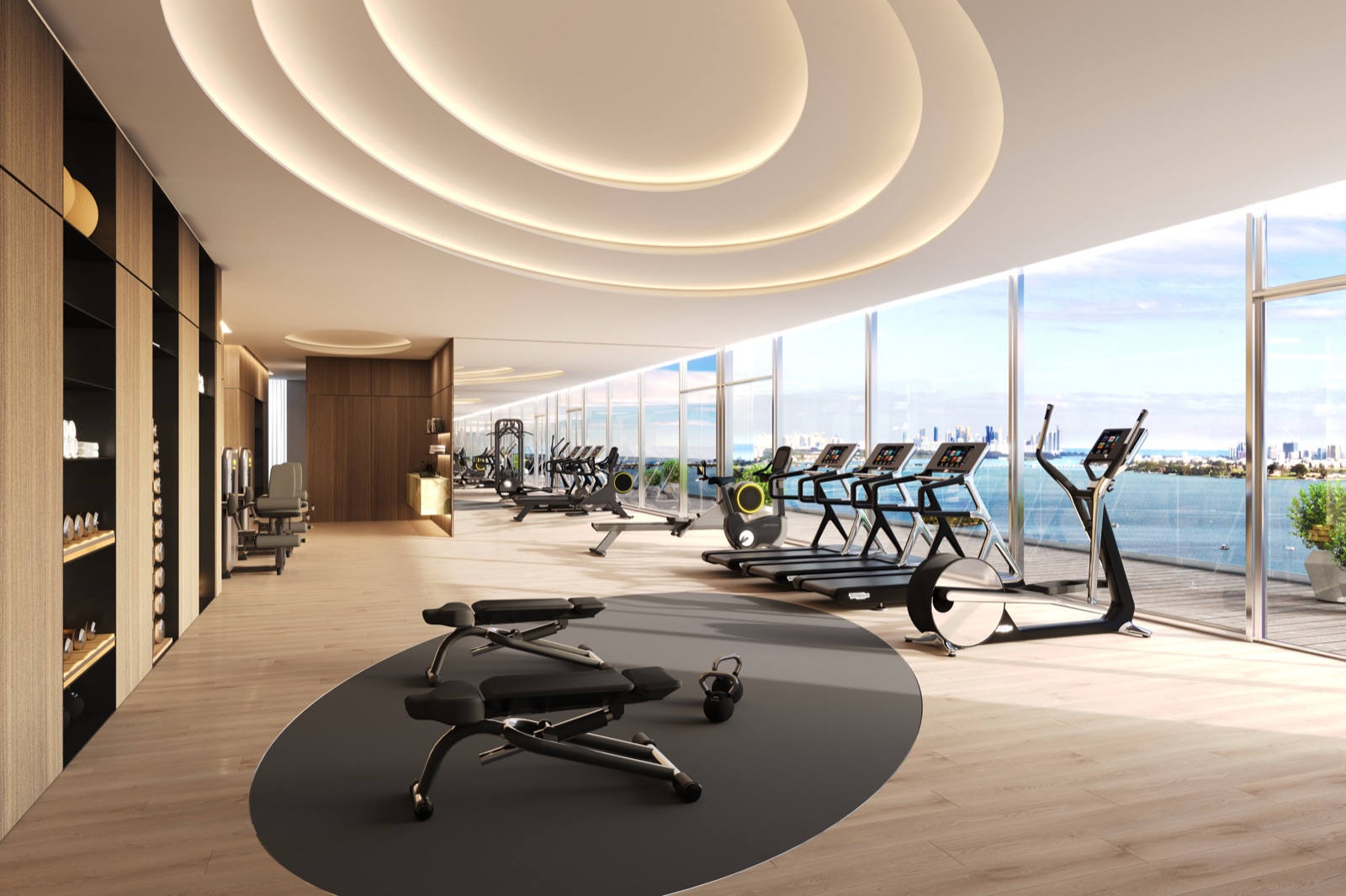 State-of-the-art fitness center with advanced cardio, pilates studio, yoga studio, and bay views.